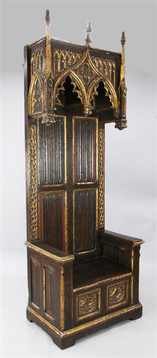 A French gothic style polychrome and parcel gilt oak Bishops throne chair, W. 2ft 10in. D. 1ft 10in. H. 8ft 4in.